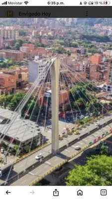 an overhead view of a bridge over a city at 
