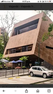 a car parked in front of a building at 