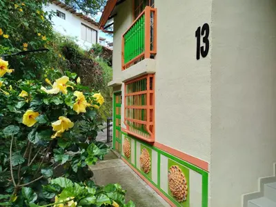 a building with a number on the side of it at casa Guatape cerca al parque y malecom in Guatapé