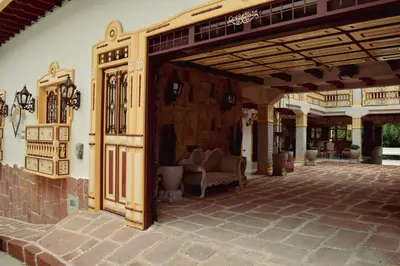 an entrance to a patio with a building at Hotel Boutique Sagrado Corazon in Abejorral