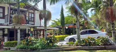 a white car parked in front of a house at Finca La Concordia in Chiquinquirá