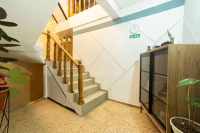 a staircase in a home with white walls at Boston Coffee Lofts in Medellín