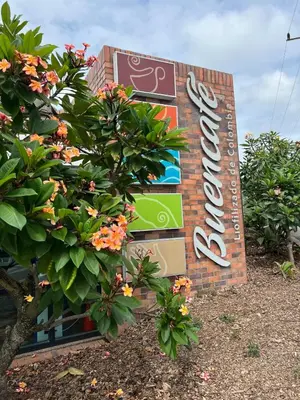 a sign on the side of a building at Hummingbird in Chinchiná