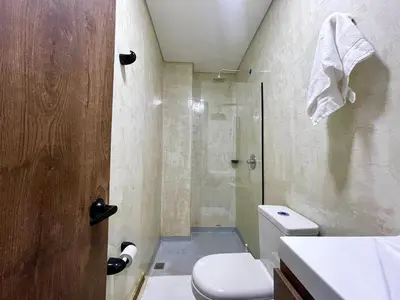 a bathroom with a shower and a toilet at 41 Experience Laureles in style and comfort in Medellín