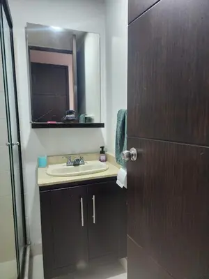a bathroom with a sink and a mirror at Habitación con sofacama - apto compartido in Envigado