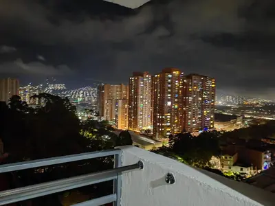a view of a city skyline at night at Edifio Barlovento in Bello