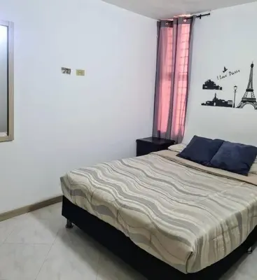 a bedroom with a bed in a white room at Apto 2 alcobas 2 baños 2 closet 2 camas dobles barrio cabañitas in Bello