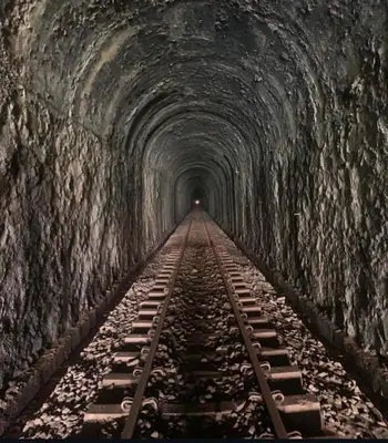 a tunnel with train tracks going through it at Glamping Mirador El Tunel in Estación El Salto
