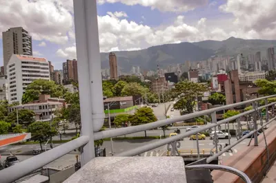 a view of a city from a balcony at Calle 10 Suites in Medellín