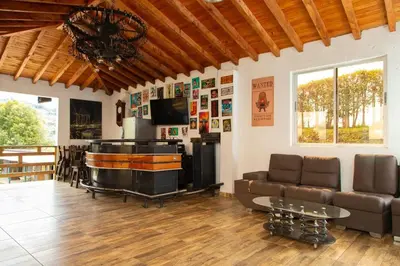 a living room with a couch and a table at Casa de Campo Monblack in El Peñol