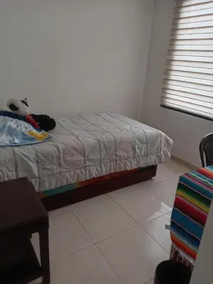 a bedroom with a bed with a teddy bear on it at Casa Piamonte in Estación El Salto