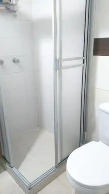 a bathroom with a shower and a toilet at Casa Piamonte in Estación El Salto