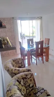 a living room with a dining table and chairs at Casa Piamonte in Estación El Salto