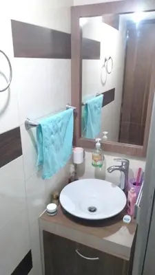 a bathroom with a white sink and a mirror at Casa Piamonte in Estación El Salto