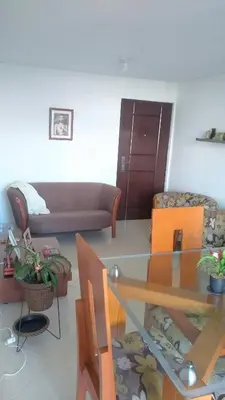 a living room with a couch and a glass table at Casa Piamonte in Estación El Salto