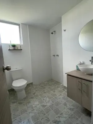 a white bathroom with a toilet and a sink at CC Fundadores, cerca sector el Cable y CC Mall Plaza in Manizales