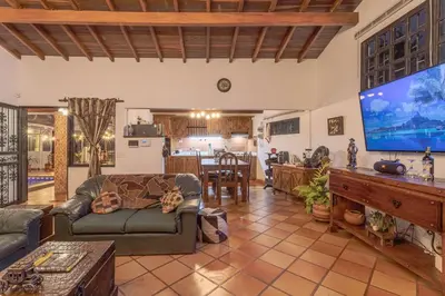 a living room with a large flat screen tv at Country Western State in Marinilla