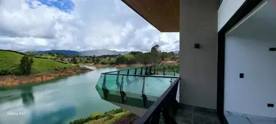 a room with a view of a river from a building at Finca Villa Glamping in La Pradera