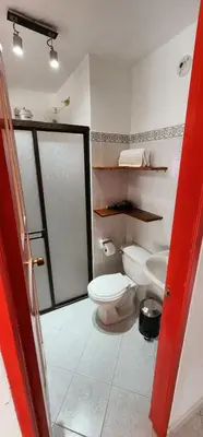 a bathroom with a toilet and a sink at Refugio Sereno en Jericó 1 in Jericó