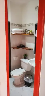 a bathroom with a toilet and a sink at Refugio Sereno en Jericó 1 in Jericó