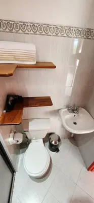 a bathroom with a toilet and a sink at Refugio Sereno en Jericó 1 in Jericó