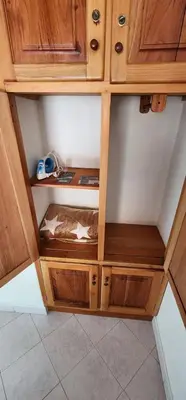 a wooden cabinet withartmentsigunigunigunigunigunigunigunigunigunigunigun at Refugio Sereno en Jericó 1 in Jericó