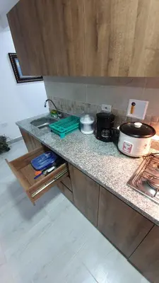 a kitchen counter with a sink and a stove at Villa Andrea Apartamento de lujo en Jericó Antioquia para 7 personas in Jericó