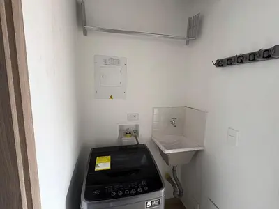 a small bathroom with a stove and a sink at New apartment in Belén in Medellín