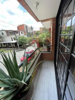 a balcony with a potted plant on a building at Premium Location Comfort in Medellín