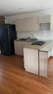 a kitchen with a sink and a counter top at Pie de Cerro Condominium in Medellín