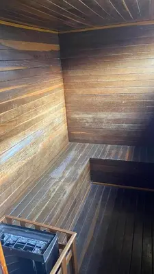an empty wooden sauna with a wooden floor at Pie de Cerro Condominium in Medellín