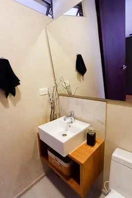 a bathroom with a sink and a mirror at New Apt w private Jacuzzi & AC in Medellín
