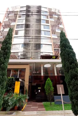 a tall building with trees in front of it at New Apt w private Jacuzzi & AC in Medellín