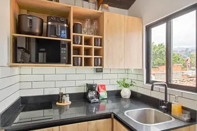 a kitchen with a sink and a window at Studio30 A, Belen, Los Molinos in Medellín