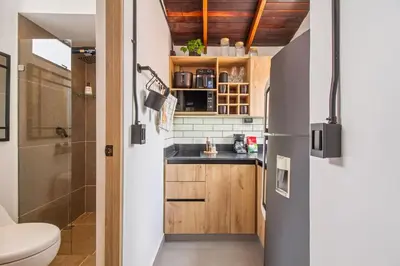 a small kitchen with a sink and a toilet at Studio30 A, Belen, Los Molinos in Medellín
