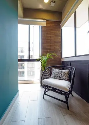 a bench sitting in a room with windows at Stylish Loft in the Heart of Laureles in Medellín