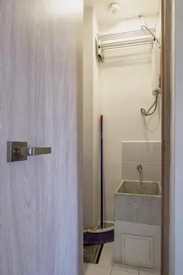 a bathroom with a sink and a shower door at Stylish Loft in the Heart of Laureles in Medellín