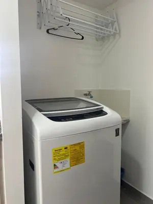 a white refrigerator in a room with a shelf at CENTRO historico y CC FUNDADORES in Manizales