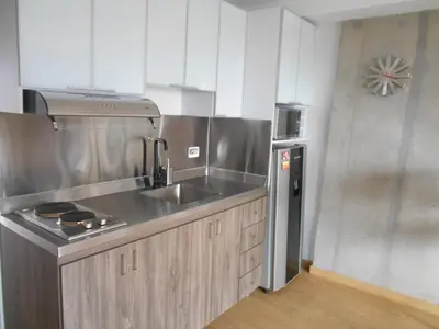 a kitchen with a sink and a refrigerator at Luxury Laureles-LA 70-Medellin Stunner in Medellín