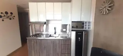 a small kitchen with a sink and a refrigerator at Modern, Stylish, Awesome Locacion, Gorgeous Views in Medellín