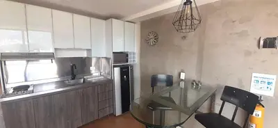 a kitchen with a glass table in a kitchen at Modern, Stylish, Awesome Locacion, Gorgeous Views in Medellín