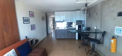 a kitchen with a couch and a table in a room at Modern, Stylish, Awesome Locacion, Gorgeous Views in Medellín