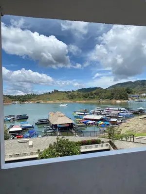 a view of a marina with boats in the water at Hotel La Aldea in Guatapé