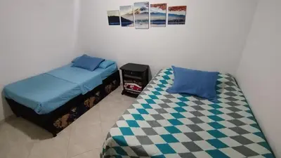 a bedroom with two beds next to each other at DESTINY Apto Central in San Rafael