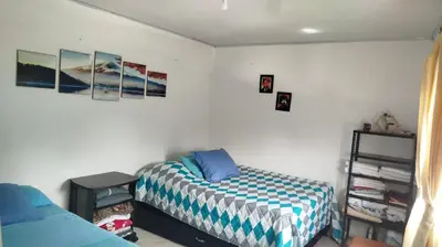 a bedroom with a bed and a shelf at DESTINY Apto Central in San Rafael