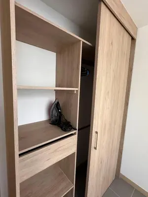 a closet in a room with wooden shelves at Lujoso apartamento, 3 habitaciones, mejor ubicación in Medellín