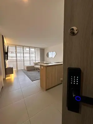 an open door to a room with a living room at Lujoso apartamento, 3 habitaciones, mejor ubicación in Medellín