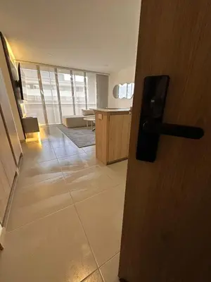 an open door to a room with a table at Apartamento en Medellín poblado in Medellín