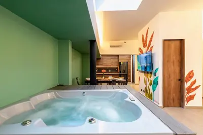 a jacuzzi tub in the middle of a room at Ll 203 4BR 4Bath Apartment close to lleras park - Poblado - Medellín in Medellín