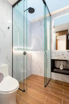 a bathroom with a glass shower and a toilet at Ll 203 4BR 4Bath Apartment close to lleras park - Poblado - Medellín in Medellín